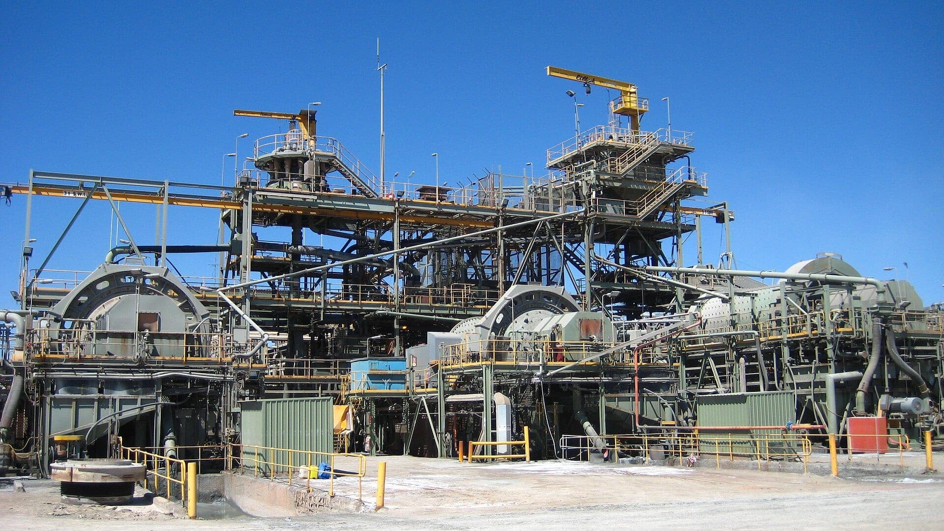 Grinding mills and steel structure of the Sunrise Dam gold processing plant under a clear sky